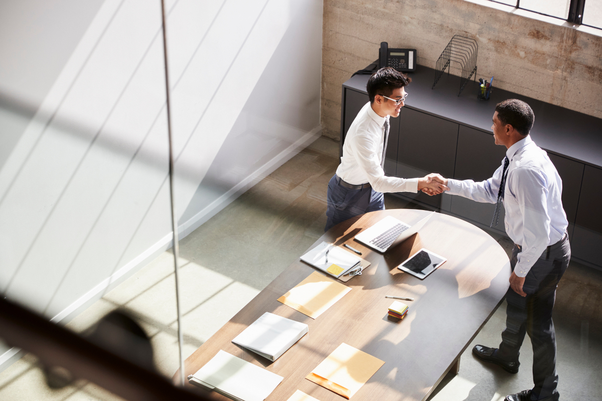 Two business people shaking hands