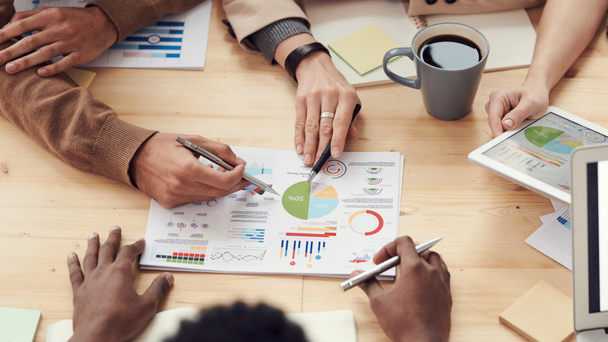 Business people discussing graphs and statistics 
